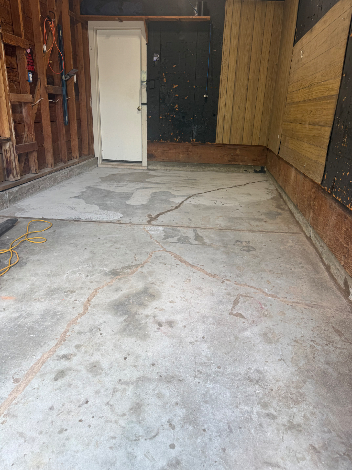 Garage concrete floor before an Elite Epoxy coating