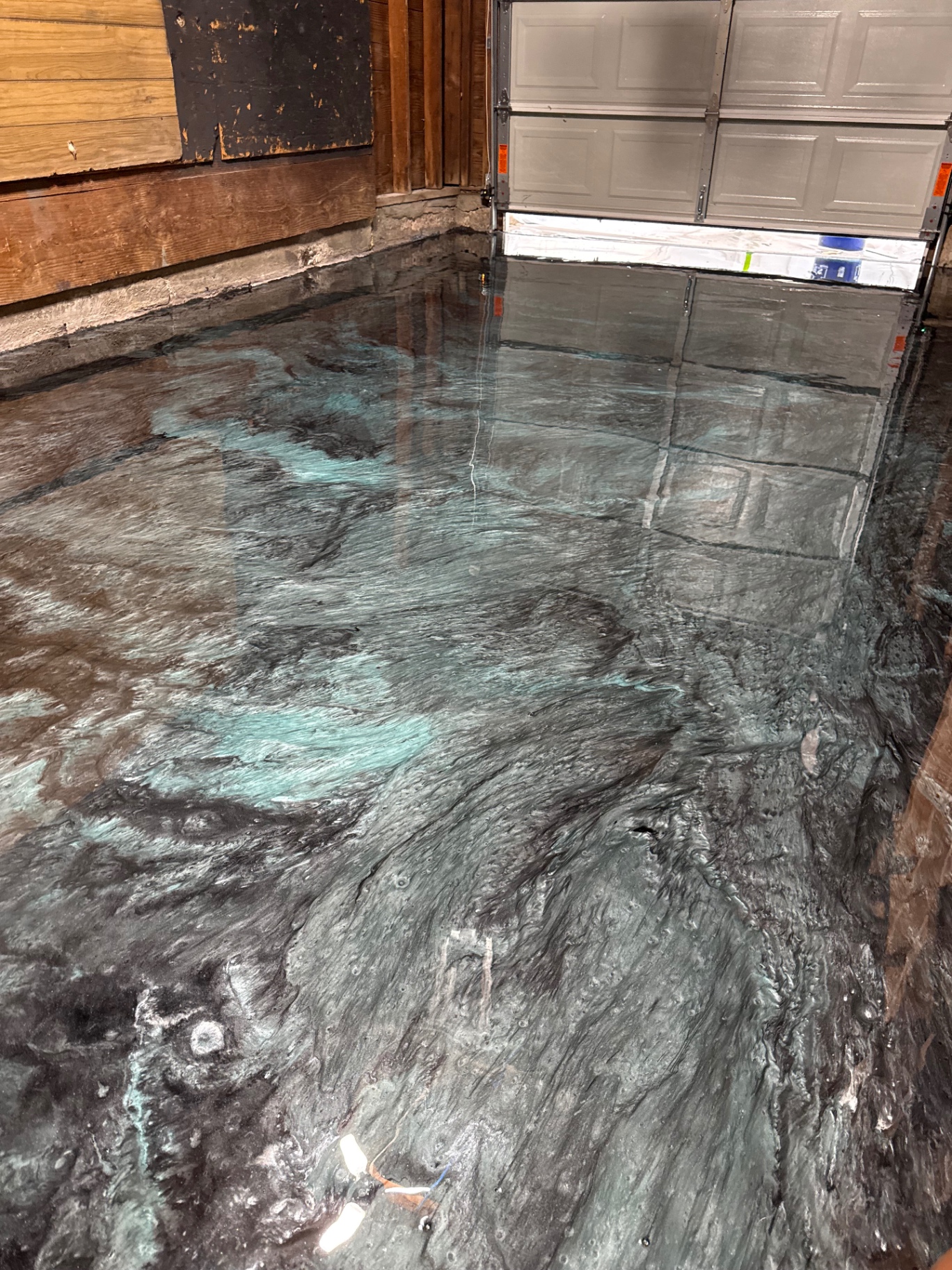Garage floor after an Elite Epoxy metallic coating